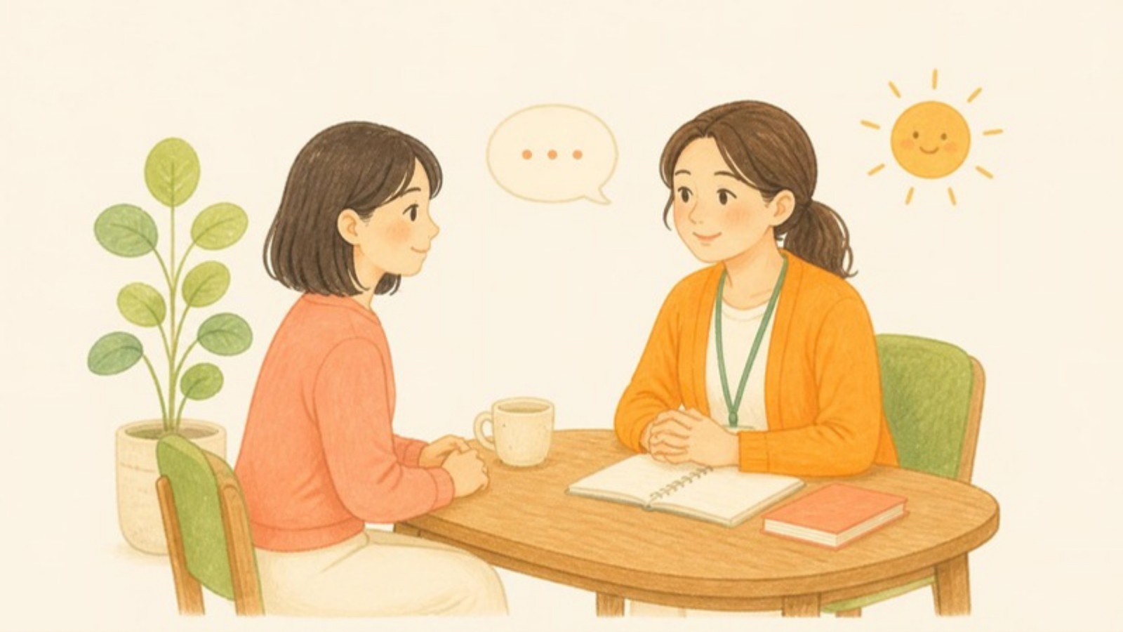 机をはさんで、仕事の相談をしている2人